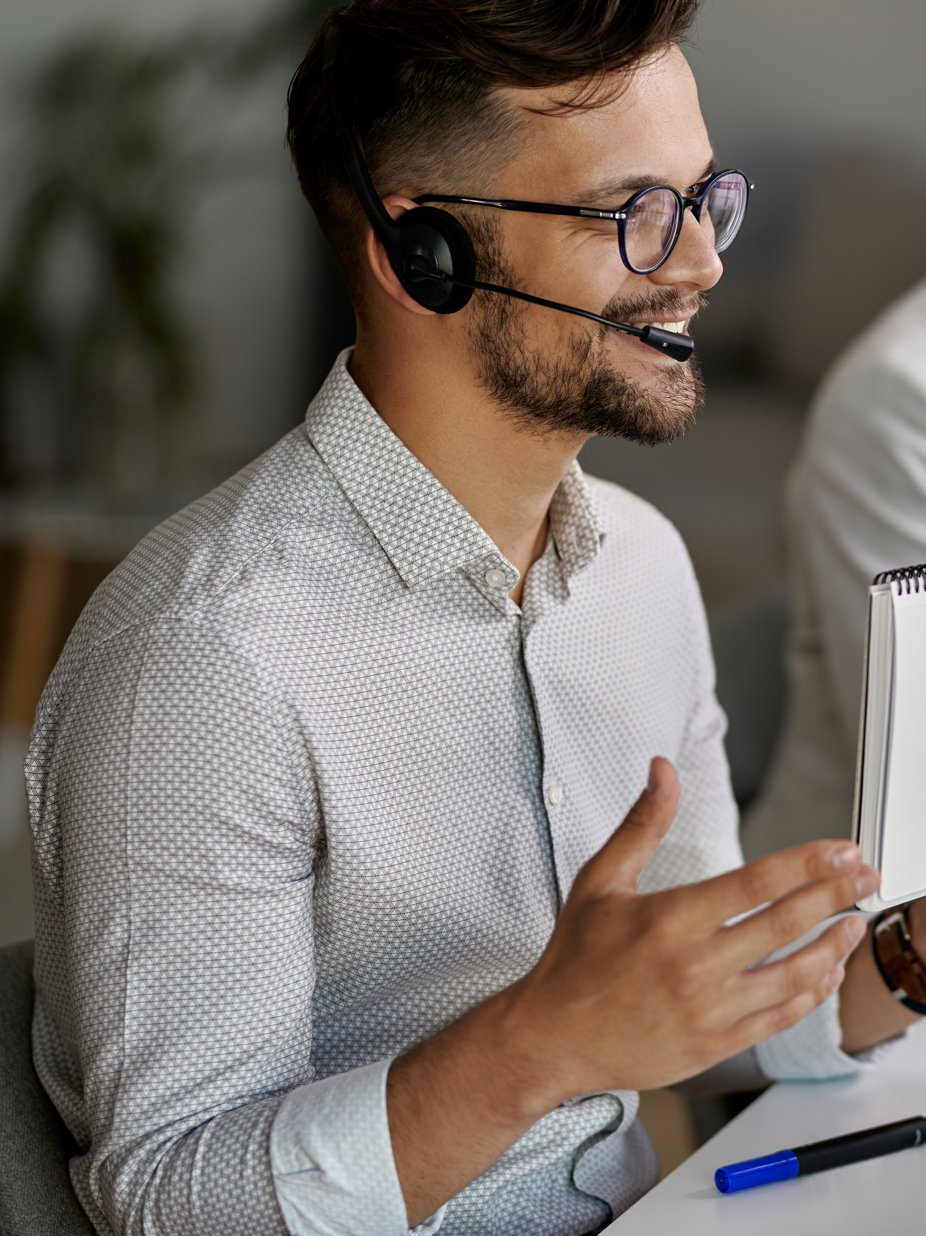 happy-customer-service-representative-using-computer-having-video-call-with-clients-while-working-call-center-2
